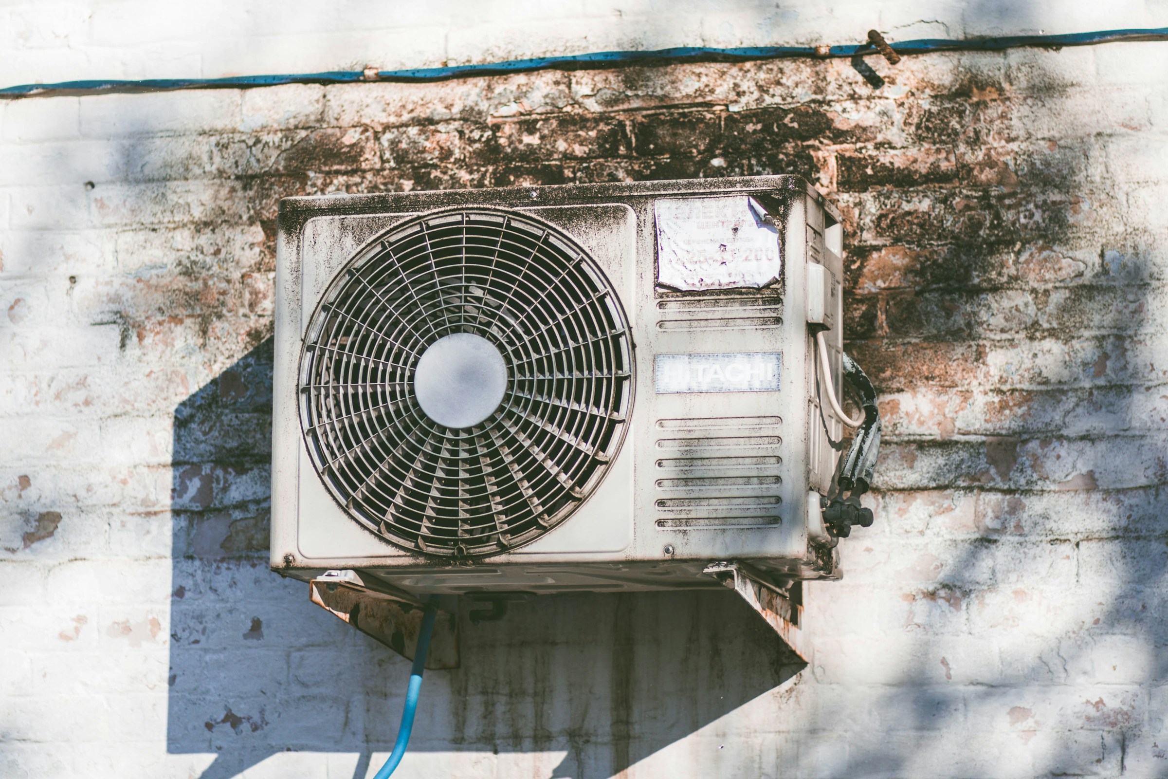 Air conditioner on a brick wall